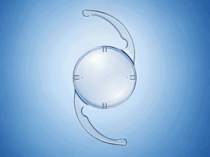 West Texas Eye Associates medical illustration of a toric intraocular lens used for cataract surgery astigmatism correction on a soft blue gradient background.
