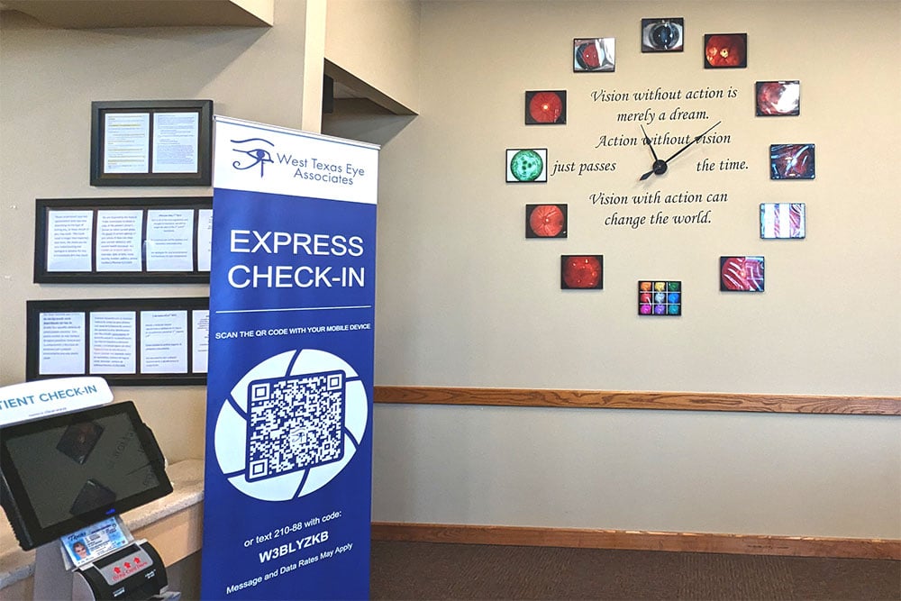 An express check-in station at West Texas Eye Associates features a QR code for convenient mobile registration, helping patients prepare for their eye care appointment.
